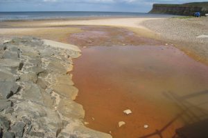 Mine water discharge onto the beach at Saltburn