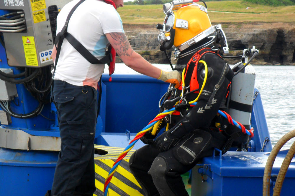Specialist diver preparing to install the diffuser
